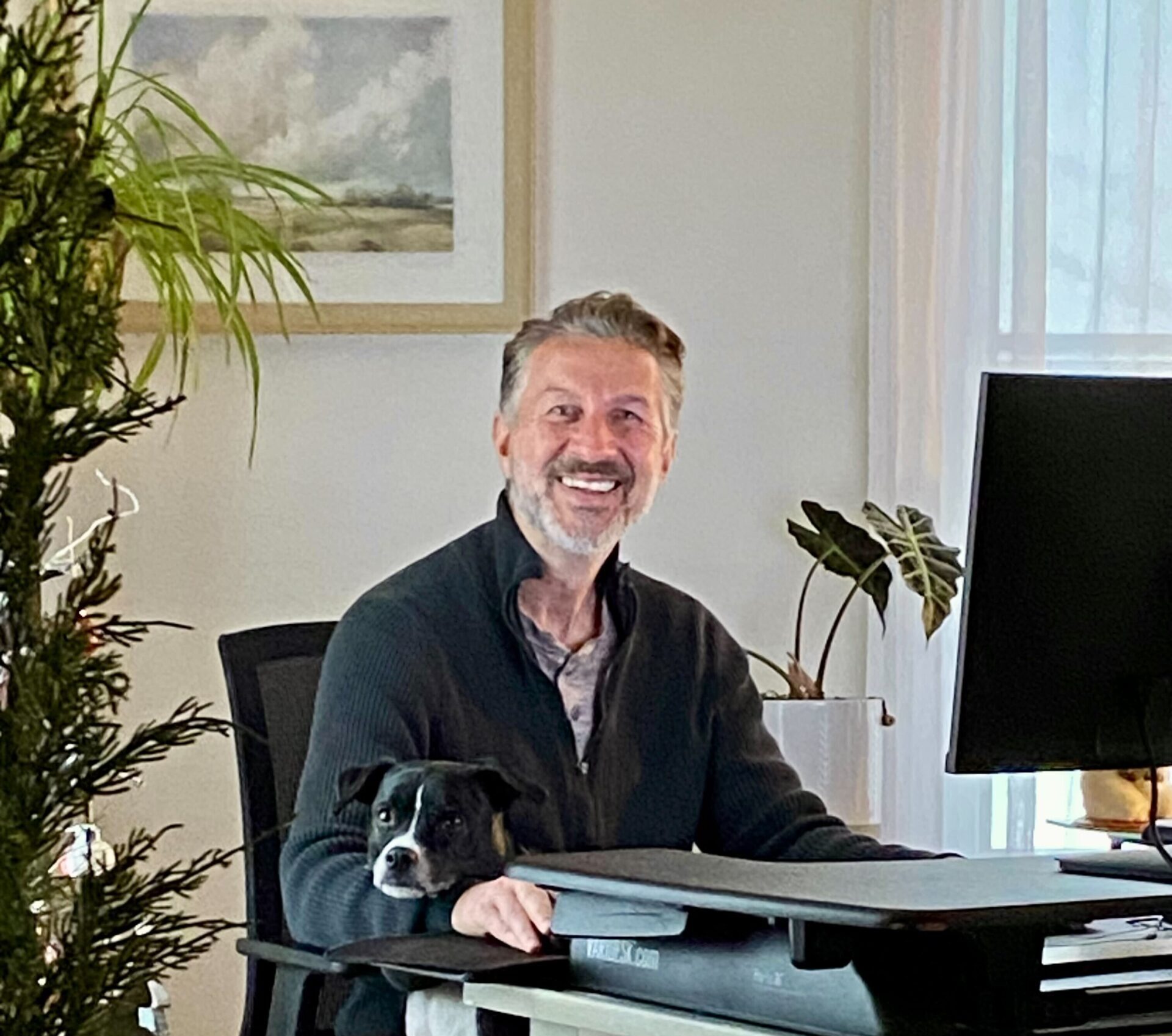 Adi Stelcer owner of Southern Maine SEO with his dog Otis at the farmhouse office in Standish ME